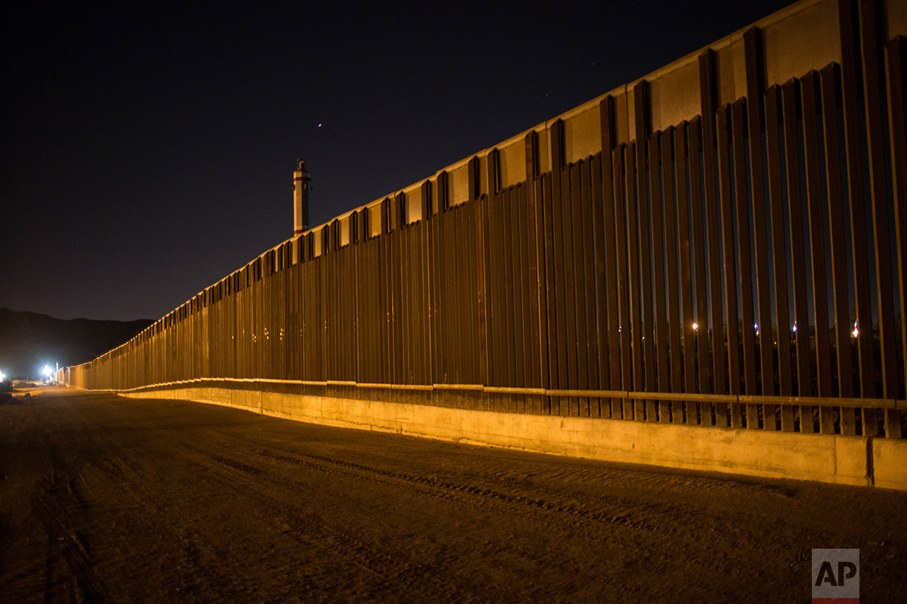 A portion of the new steel border fence stretches along the US-Mexico border in Sunland Park, New Mexico, Thursday, March 30, 2017. This fencing just west of the New Mexico state line was planned and started before President Donald Trump's election, adding to the 650 miles of fences, walls and vehicle barriers that already exist along the nearly 2,000-mile frontier. (AP Photo/Rodrigo Abd)
