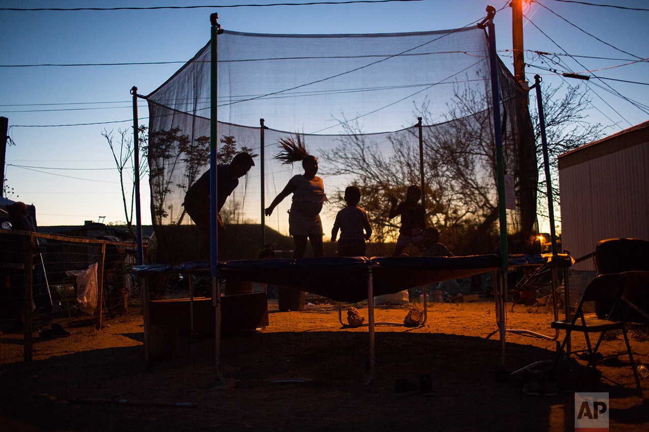  Children play  late afternoon in Sunland Park, near the new fence at the US-Mexico border in New Mexico, US, Thursday, March 30, 2017. (AP Photo/Rodrigo Abd) 