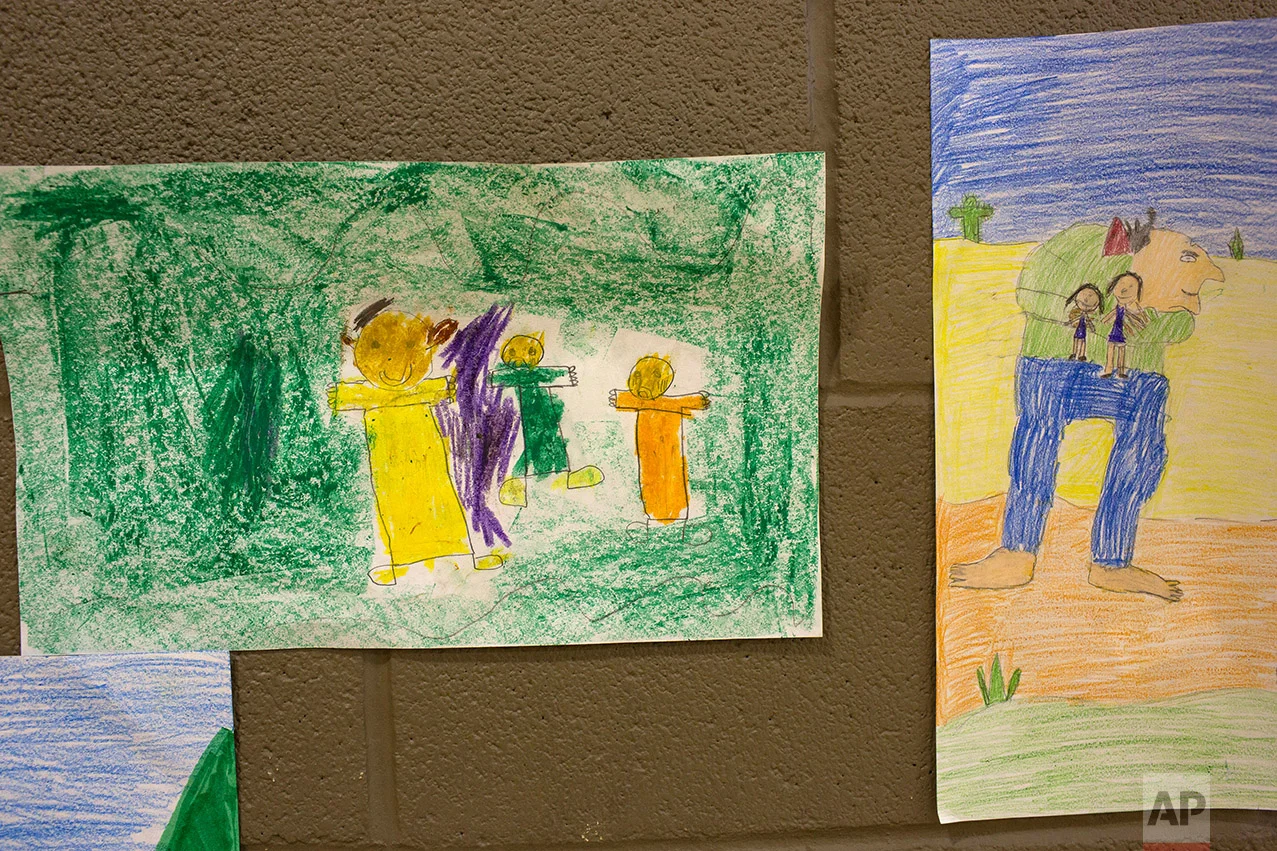 Students interpretive drawings of "The Gum-Chewing Rattler" by Joe Hayes are displayed in the gym at Columbus Elementary School, in Columbus, New Mexico, Friday, March 31, 2017. (AP Photo/Rodrigo Abd) 