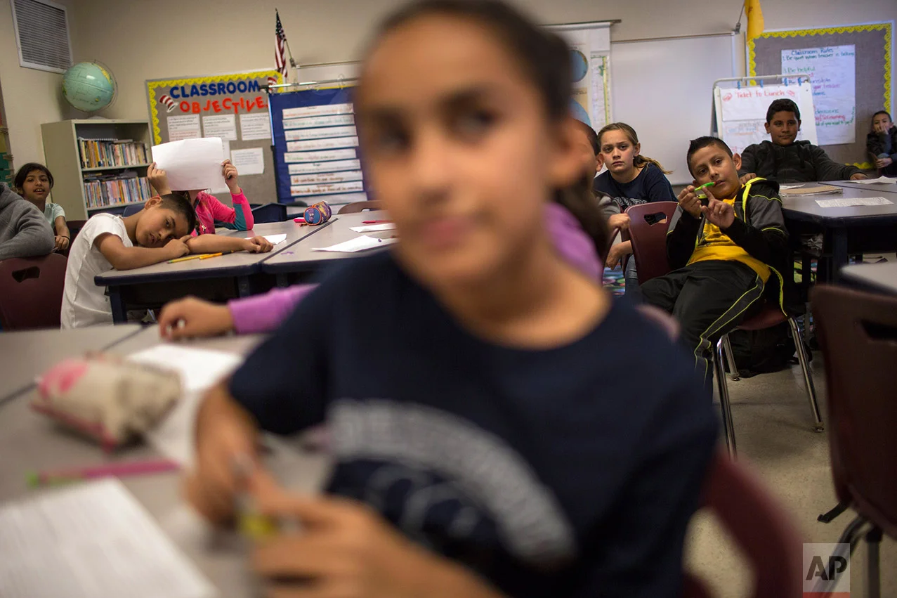Fifth graders sit in their civics class at Columbus Elementary School, in Columbus, New Mexico, Friday, March 31, 2017. (AP Photo/Rodrigo Abd)