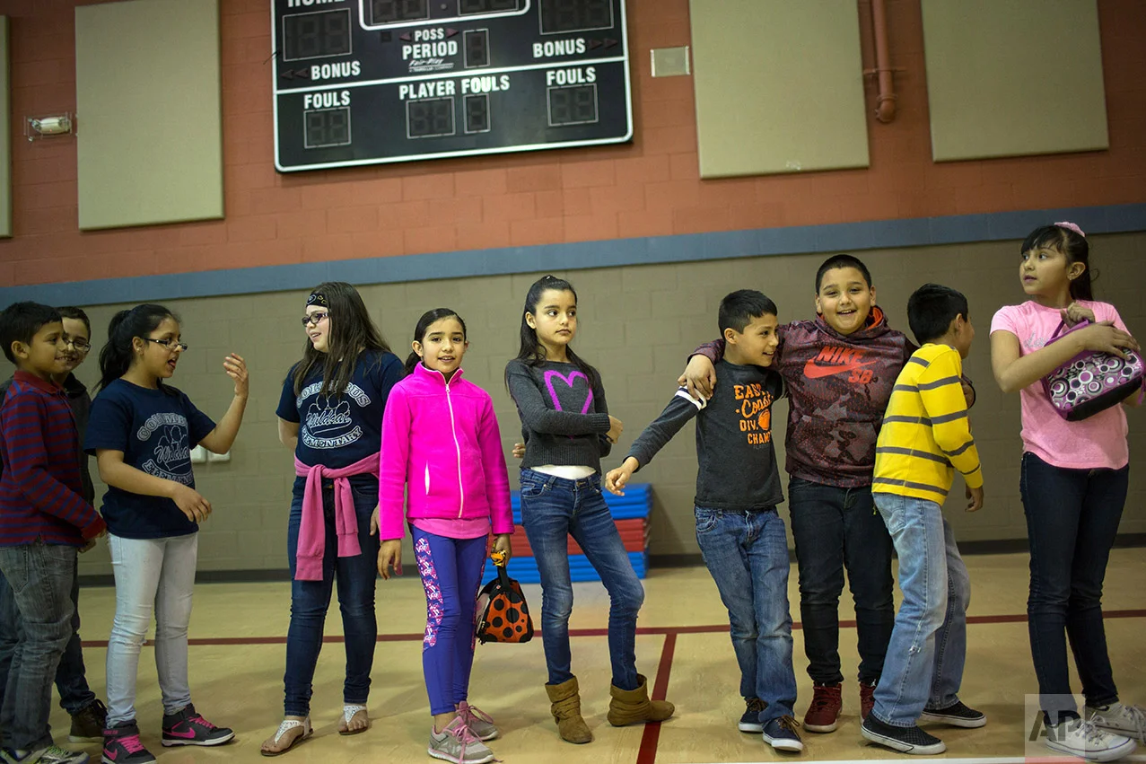 Students line up to return to their classroom at Columbus Elementary School, in Columbus, New Mexico, US, Friday, March 31, 2017. (AP Photo/Rodrigo Abd)