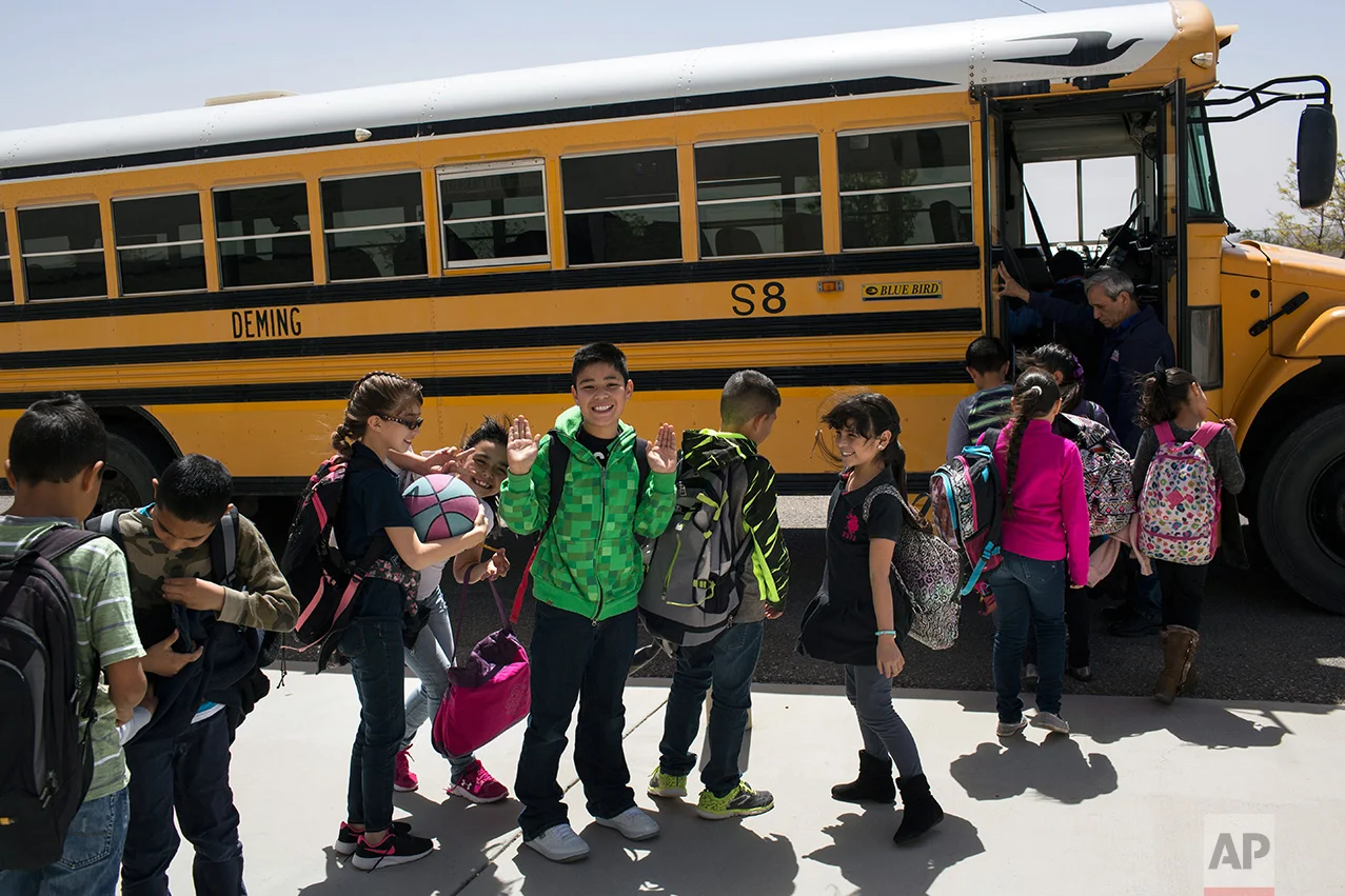 Students board a school bus home at Columbus Elementary School, in Columbus, New Mexico, US, Friday, March 31, 2017. (AP Photo/Rodrigo Abd)