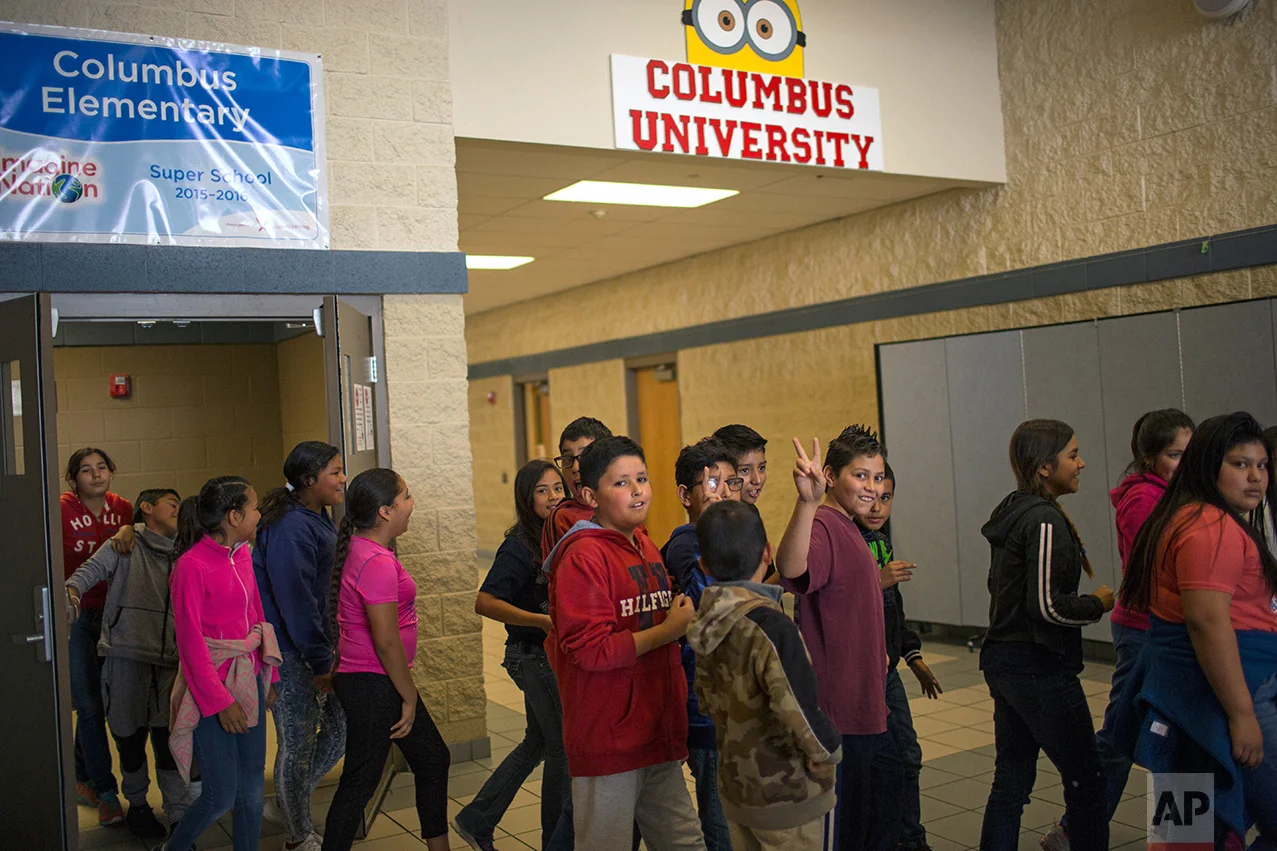Students line up to return to their classroom at Columbus Elementary School, in Columbus, New Mexico, US, Friday, March 31, 2017. (AP Photo/Rodrigo Abd)