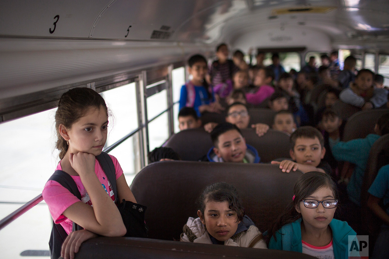  Students wait inside a school bus at Columbus Elementary School, in Columbus, New Mexico, Friday, March 31, 2017, to be transported to the U.S. port of entry on the border with Puerto Palomas, Mexico. (AP Photo/Rodrigo Abd) 