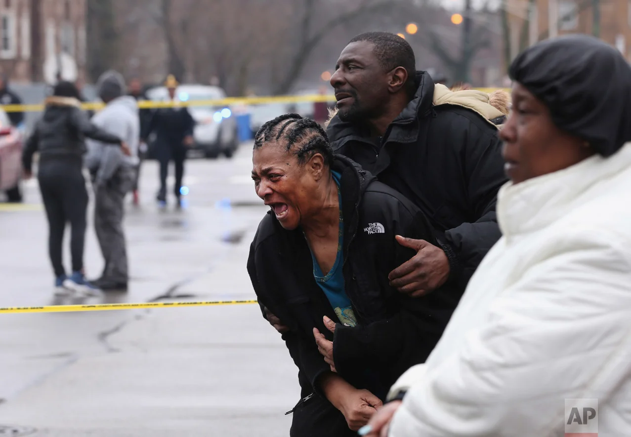 Georgia Jackson, 72, is overcome with emotion after learning that her two grandsons, Raheem, 19, and Dillon Jackson, 20, were found fatally shot in the South Shore neighborhood in Chicago on Thursday, March 30, 2017. Chicago police said Thursday several people were found fatally shot Thursday in or near a restaurant. Georgia Jackson said the two had gone to the restaurant to get food and to see their mother, who works there. (Chris Sweda/Chicago Tribune via AP)