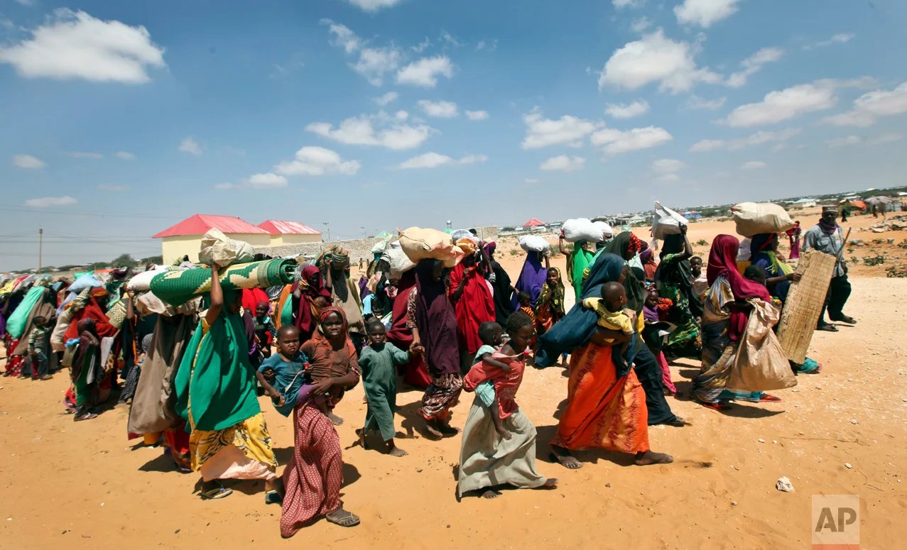 Families internally displaced by drought arrive at makeshift camps in the Tabelaha area on the outskirts of Mogadishu, Somalia, Thursday, March 30, 2017. Somalia's current drought is threatening half of the country's population, about 6 million people, according to the United Nations. Aid agencies have scaled up efforts but say more support is urgently needed. (AP Photo/Farah Abdi Warsameh)