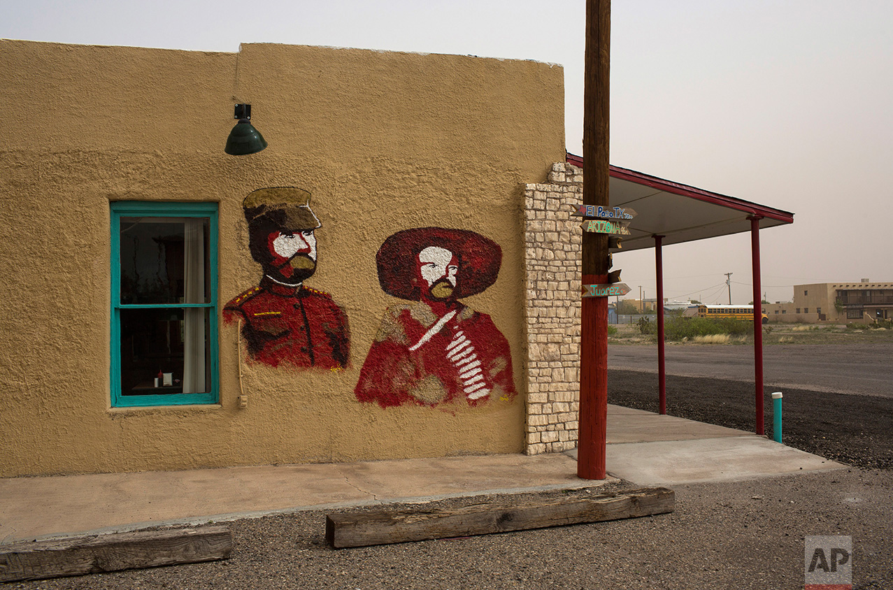  A mural depicts Mexican bandit and guerrilla leader in the Mexican Revolution Pancho Villa, right, and U.S Gen. John J. Pershing, side by side, on the wall of a cafe in Columbus, New Mexico, Friday, March 31, 2017. (AP Photo/Rodrigo Abd) 