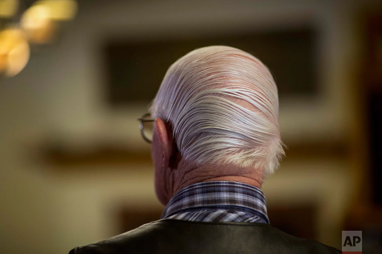 Rancher Jim Chilton shows off a combover hairstyle after removing his hat in his 50,000-acre ranch along the US-Mexico border in Arivaca, Ariz., Sunday, April 2, 2017. (AP Photo/Rodrigo Abd)