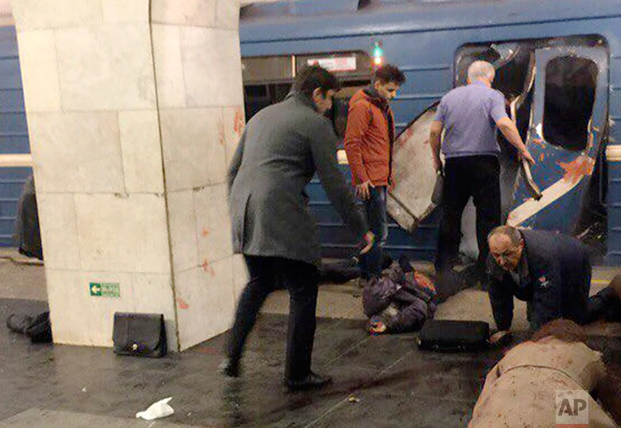Blast victims lie near a subway train hit by a explosion at the Tekhnologichesky Institut subway station in St. Petersburg, Russia, Monday, April 3, 2017. (AP Photo/DTP&ChP St. Peterburg via AP)