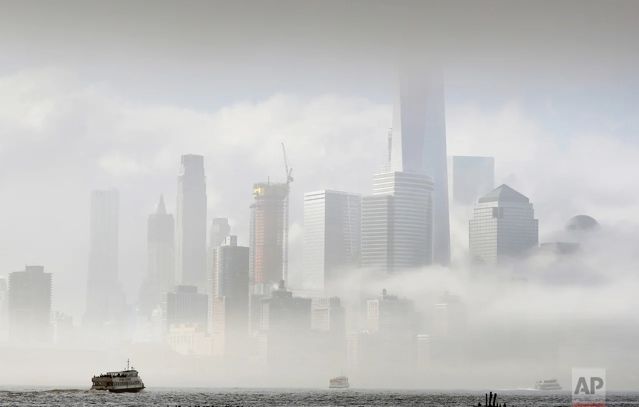 A commuter ferry crosses the Hudson River to New York City, Wednesday, April 5, 2017, in this photo from Hoboken, N.J. Many commuters are shifting to the ferry service following Monday's derailment of a NJ Transit train which has lead to reduced train service into New York. (AP Photo/Mark Lennihan)