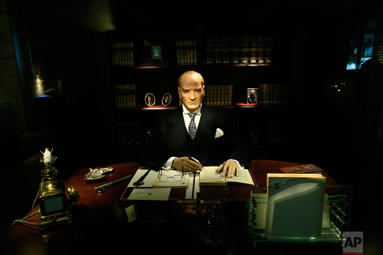 In this March 29, 2017 photo, a wax figure of Mustafa Kemal Ataturk, the founder of modern Turkey is exhibited at the museum adjacent to his mausoleum in Ankara, Turkey. The legacy of the man whose surname means "father of Turks" was one of a modern, secular, western-leaning Turkey. But the personality cult that grew around him has very gradually been fading as current President Recep Tayyip Erdogan, in power since 2003 as alternately prime minister and president, has harked back to the glory days of the height of the Ottoman Empire to whip up patriotic sentiment. (AP Photo/Lefteris Pitarakis)