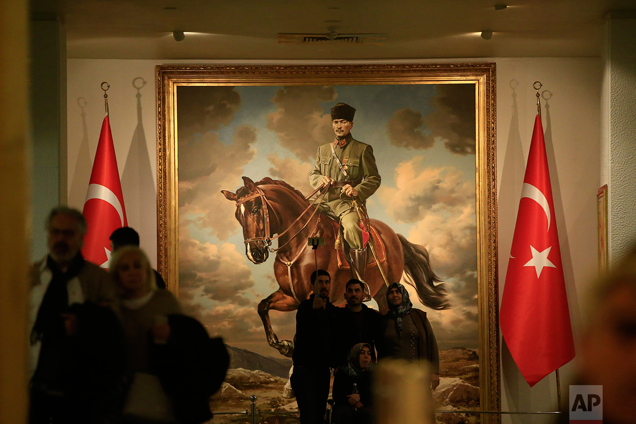 In this March 29, 2017 photo, a painting of Mustafa Kemal Ataturk, the founder of modern Turkey is exhibited at the museum addict to his mausoleum in Ankara, Turkey. Ataturk' mausoleum, a sprawling complex built in the early 1950s in the Turkish capital, is still a place of pilgrimage for many. Families, schoolchildren, elderly people, veiled Muslim women all come to pay homage to his memory. (AP Photo/Lefteris Pitarakis)