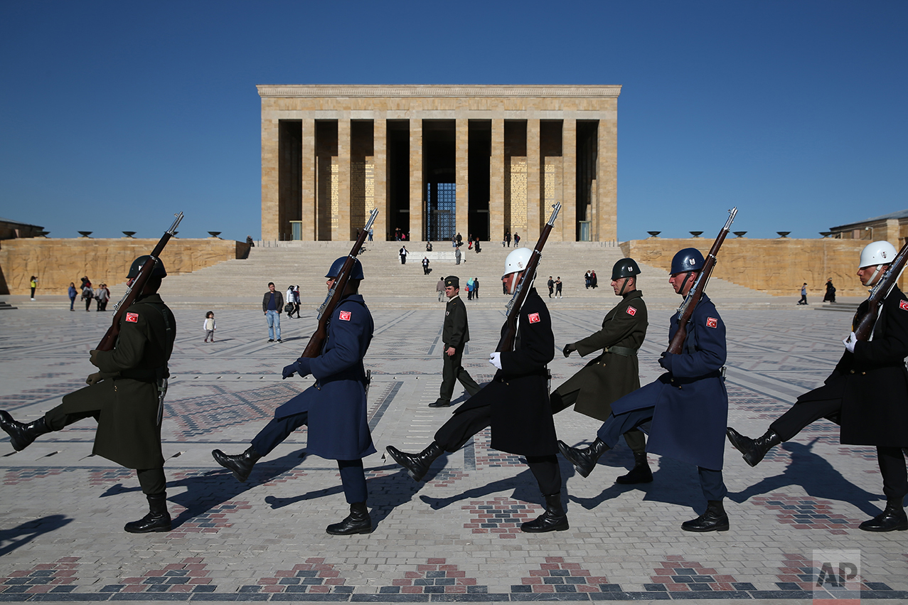 In this March 29, 2017 photo, Turkish military honour guards perform the hourly changing of the guard at the mausoleum of Mustafa Kemal Ataturk, the founder of modern Turkey in Ankara, Turkey. The legacy of the man whose surname means "father of Turks" was one of a modern, secular, western-leaning Turkey. But the personality cult that grew around him has very gradually been fading as current President Recep Tayyip Erdogan, in power since 2003 as alternately prime minister and president, has harked back to the glory days of the height of the Ottoman Empire to whip up patriotic sentiment. (AP Photo/Lefteris Pitarakis)
