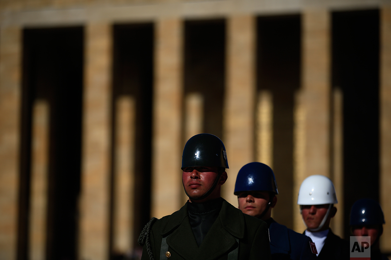 In this March 29, 2017 photo, Turkish military honour guards perform the hourly changing of the guard at the mausoleum of Mustafa Kemal Ataturk, the founder of modern Turkey in Ankara, Turkey. The legacy of the man whose surname means "father of Turks" was one of a modern, secular, western-leaning Turkey. (AP Photo/Lefteris Pitarakis)