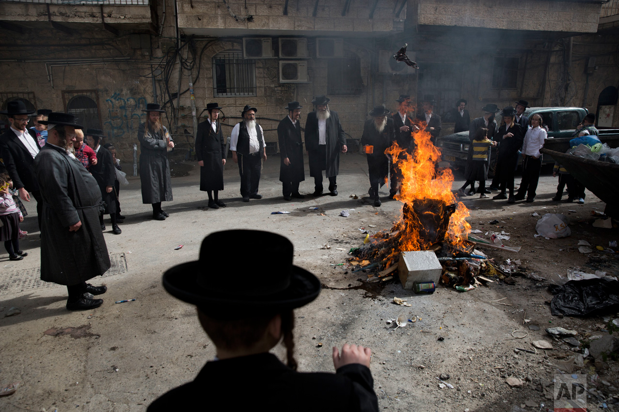 Ultra-Orthodox Jews burn leavened items in final preparation for the Passover holiday in Jerusalem, Monday, April 10, 2017. Jews are forbidden to eat leavened foodstuffs during the Passover holiday that celebrates the biblical story of the Israelites' escape from slavery and exodus from Egypt. (AP Photo/Oded Balilty)