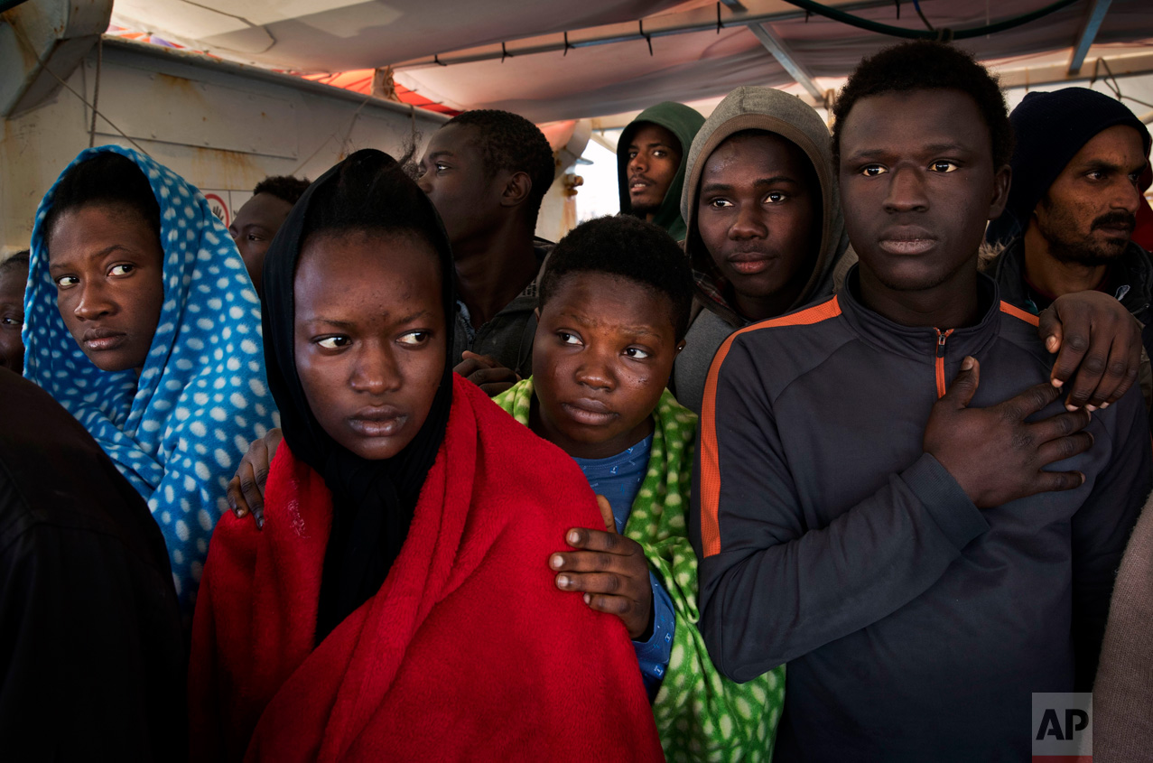 Migrants aboard the Golfo Azurro rescue vessel wait to be transferred to Italian authorities in Trapani harbor, on the Italian island of Sicily, Saturday, April 8, 2017. Most migrants on the Mediterranean are now trying to reach Italy. Those numbers have dramatically increased since the European Union and Turkey signed an agreement last year that allowed Greece to send new asylum-seekers back to Turkey. (AP Photo/Bernat Armangue)