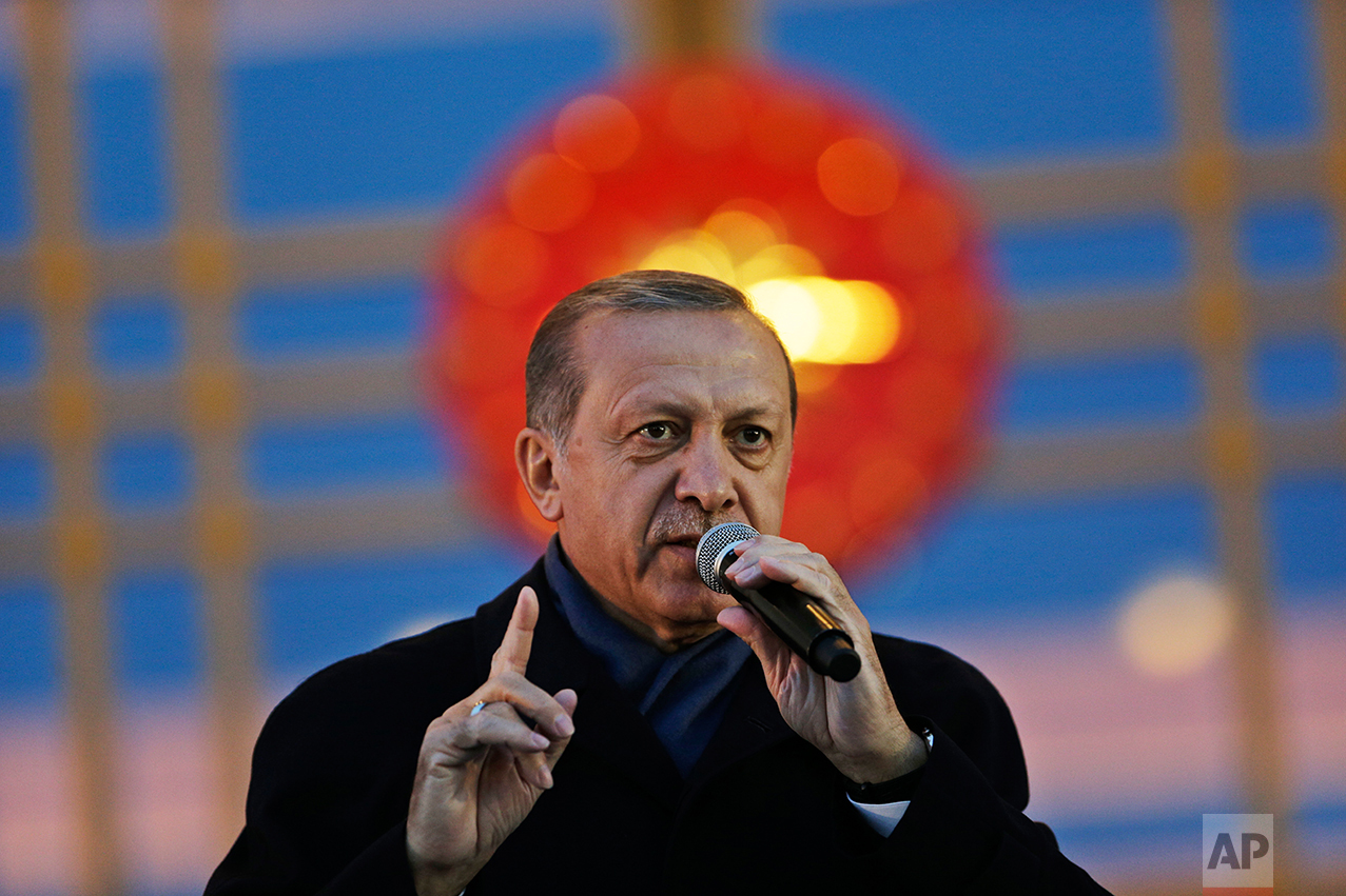 Turkey's President Recep Tayyip Erdogan, gestures while delivering a speech during a rally of supporters a day after the referendum, outside the Presidential Palace, in Ankara, Turkey, Monday, April 17, 2017. Turkey's main opposition party urged the country's electoral board Monday to cancel the results of a landmark referendum that granted sweeping new powers to Erdogan, citing what it called substantial voting irregularities. (AP Photo/Burhan Ozbilici)