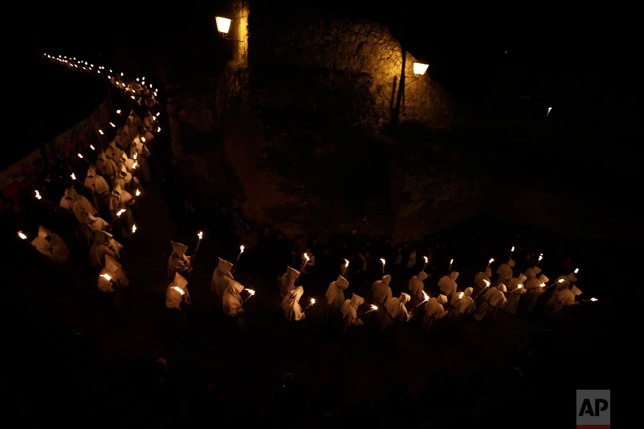 In this Tuesday, April 11, 2017 photo, penitents from 'Cristo de la Buena Muerte' or 'Good Dead Christ' brotherhood take part in a procession in Zamora, Spain. (AP Photo/Daniel Ochoa de Olza)