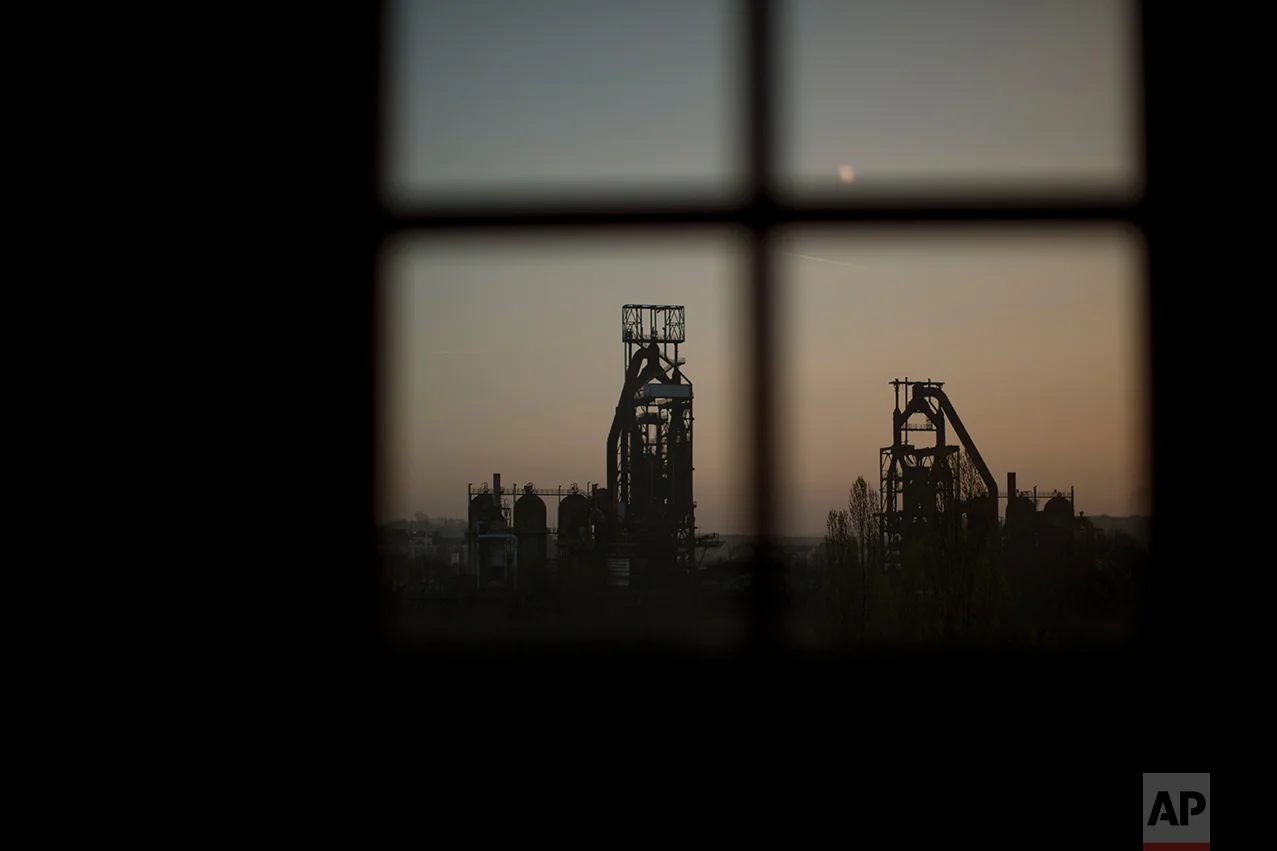 An abandoned steelworks with blast furnaces. (AP Photo/Emilio Morenatti)