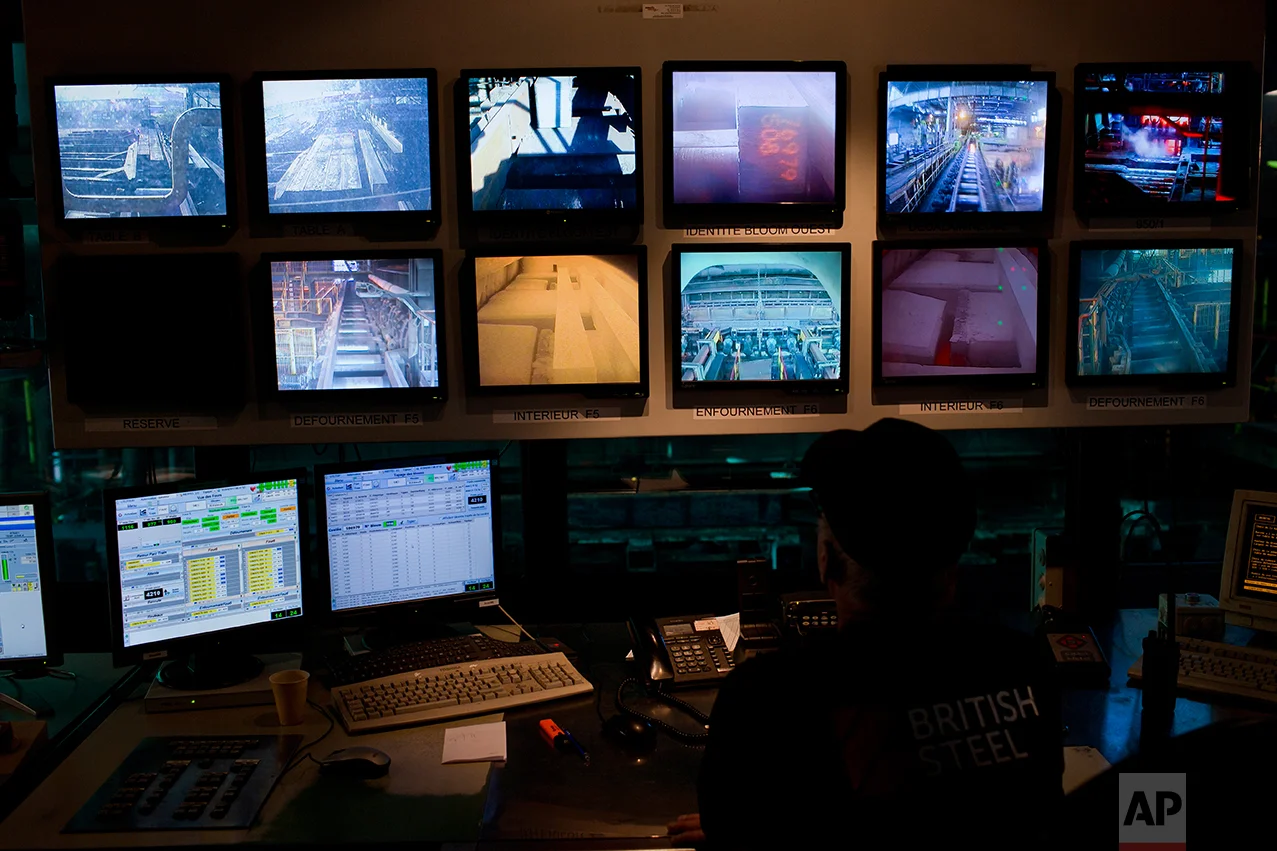 Monitors as a worker controls the production inside the "British Steel" factory. (AP Photo/Emilio Morenatti)