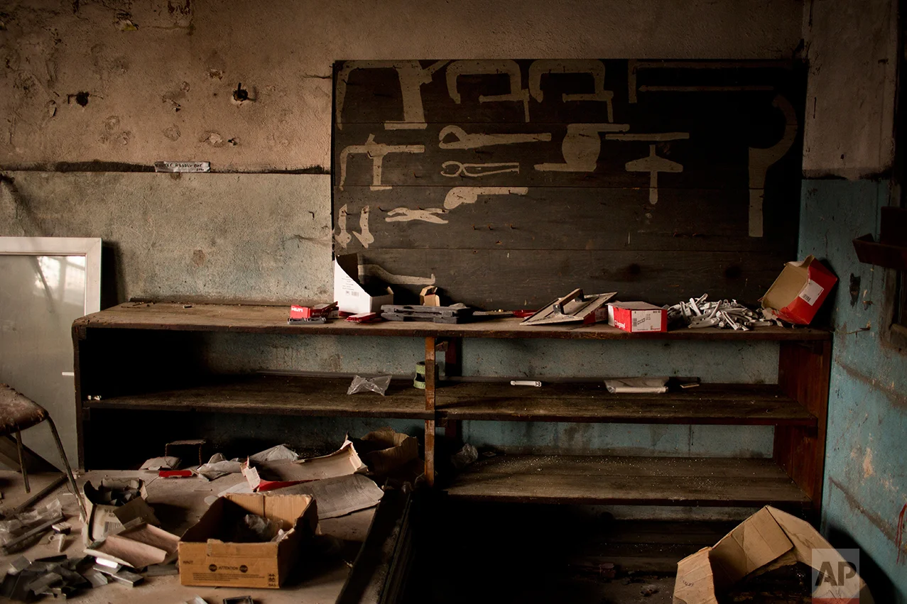 In this Monday April 3, 2017 photo, a former repair shop inside an abandoned industrial unit at Hayange, a commune in the Moselle department in Grand Est in north-eastern France. (AP Photo/Emilio Morenatti)