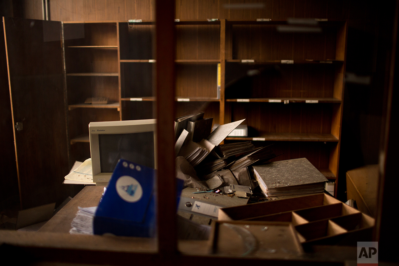 This Monday April 3, 2017 photo shows the office of a former factory inside an abandoned industrial unit at Hayange, a commune in the Moselle department in Grand Est in north-eastern France. (AP Photo/Emilio Morenatti)