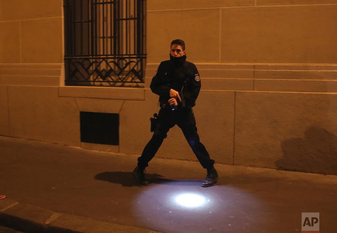 A police officer stands guard near the Champs Elysees boulevard in Paris, France, after a fatal shooting in which a police officer was killed along with an attacker, Thursday, April 20, 2017. The Islamic State group took responsibility for the act. (AP Photo/Thibault Camus)