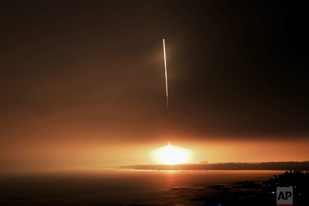 In this photo released by Xinhua News Agency, a Long March 7 rocket carrying the Tianzhou 1 cargo spacecraft blasts off from the Wenchang Space Launch Center in Wenchang in southern China's Hainan Province, Thursday, April 20, 2017. China has launched its first unmanned cargo spacecraft Thursday on a mission to dock with the country's space station. (Yang Guanyu/Xinhua via AP)