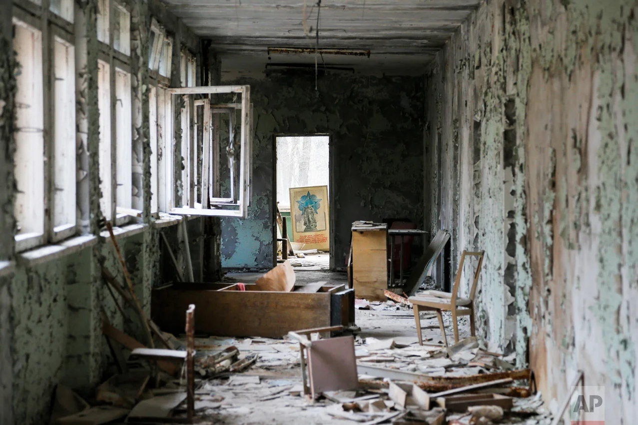 This photo taken Wednesday, April 5, 2017, shows a room in a dilapidated building, part of a school in the deserted town of Pripyat, some 3 kilometers (1.86 miles) from the Chernobyl nuclear power plant Ukraine. (AP Photo/Efrem Lukatsky)