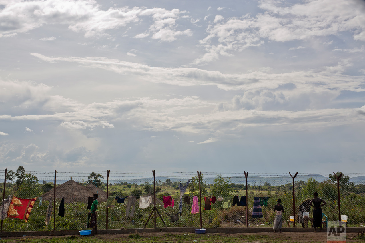 In this Wednesday March 29, 2017 photo, laundry is set to dry on the perimeter fence surrounding the Imvepi refugee settlement processing center in northern Uganda. There were high hopes that South Sudan would have peace and stability after its independence from neighboring Sudan in 2011. But the country plunged into ethnic violence in December 2013 when forces loyal to President Salva Kiir, a Dinka, started battling those loyal to Riek Machar, his former vice president who is a Nuer. (AP Photo/Jerome Delay)