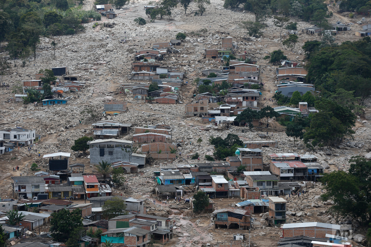 Destroyed homes are seen from the air in Mocoa, Colombia, Tuesday, April 4, 2017. Colombian authorities said at least 273 people were killed when rivers surrounding Mocoa overflowed and sent a wall of water and debris surging through the city over the weekend. The death toll was expected to rise since many more were missing and bodies are still being found. (AP Photo/Fernando Vergara)