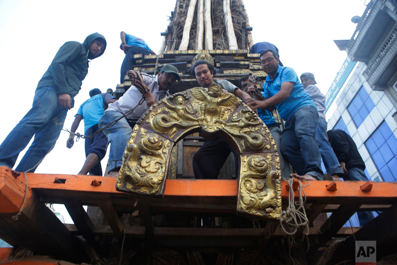  In this April 27, 2017 photo, members of the Barahi community construct the Rato Machindranath Chariot in Lalitpur, Nepal. The wooden chariot is built to appease the gods in hopes of being blessed with a good rainfall followed by a bountiful harvest