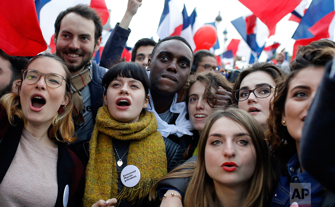  Supporters of French independent centrist presidential candidate, Emmanuel Macron wait for the results outside the Louvre museum in Paris, France, Sunday, May 7, 2017. (AP Photo/Laurent Cipriani) 