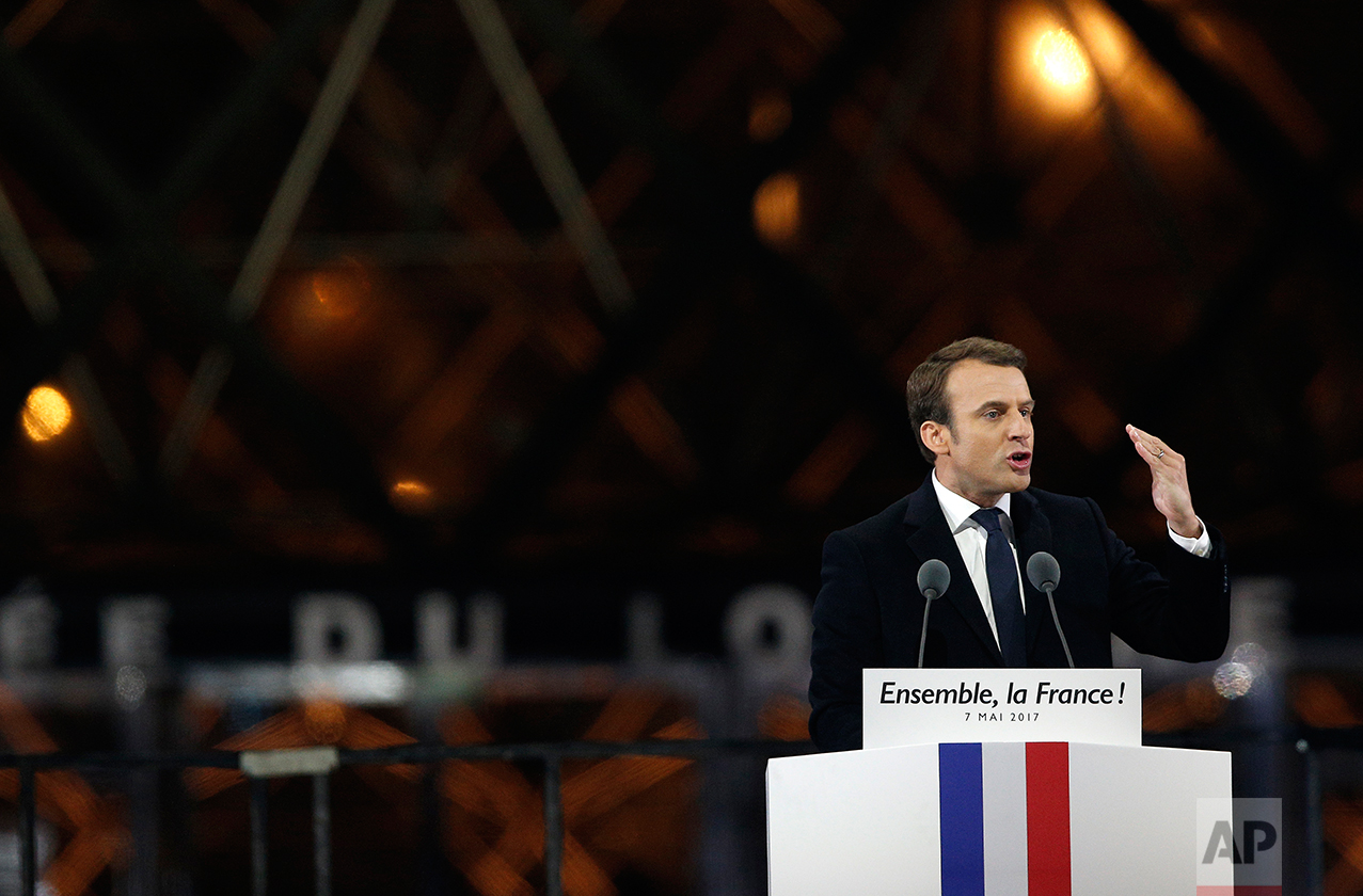  French President-elect Emmanuel Macron gestures as he speaks during a victory celebration outside the Louvre museum in Paris, France, Sunday, May 7, 2017. Speaking to thousands of supporters from the Louvre Museum's courtyard, Macron said that Franc