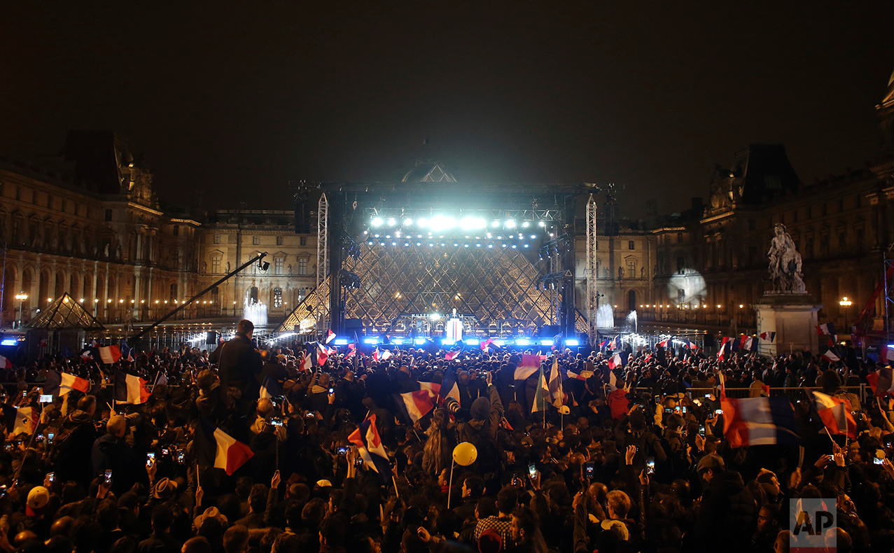  French President-elect Emmanuel Macron speaks during a victory celebration outside the Louvre museum in Paris, France, Sunday, May 7, 2017. Speaking to thousands of supporters from the Louvre Museum's courtyard, Macron said that France is facing an 