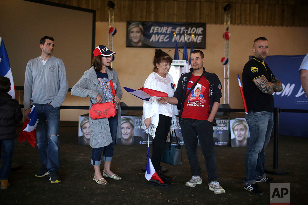  Supporters of Far-right candidate for the presidential election Marine Le Pen, wait prior to a meeting in La Bazoche Gouet, central France, Monday, April 3, 2017. A self-described patriot, Le Pen hopes to extract France from the European Union and d