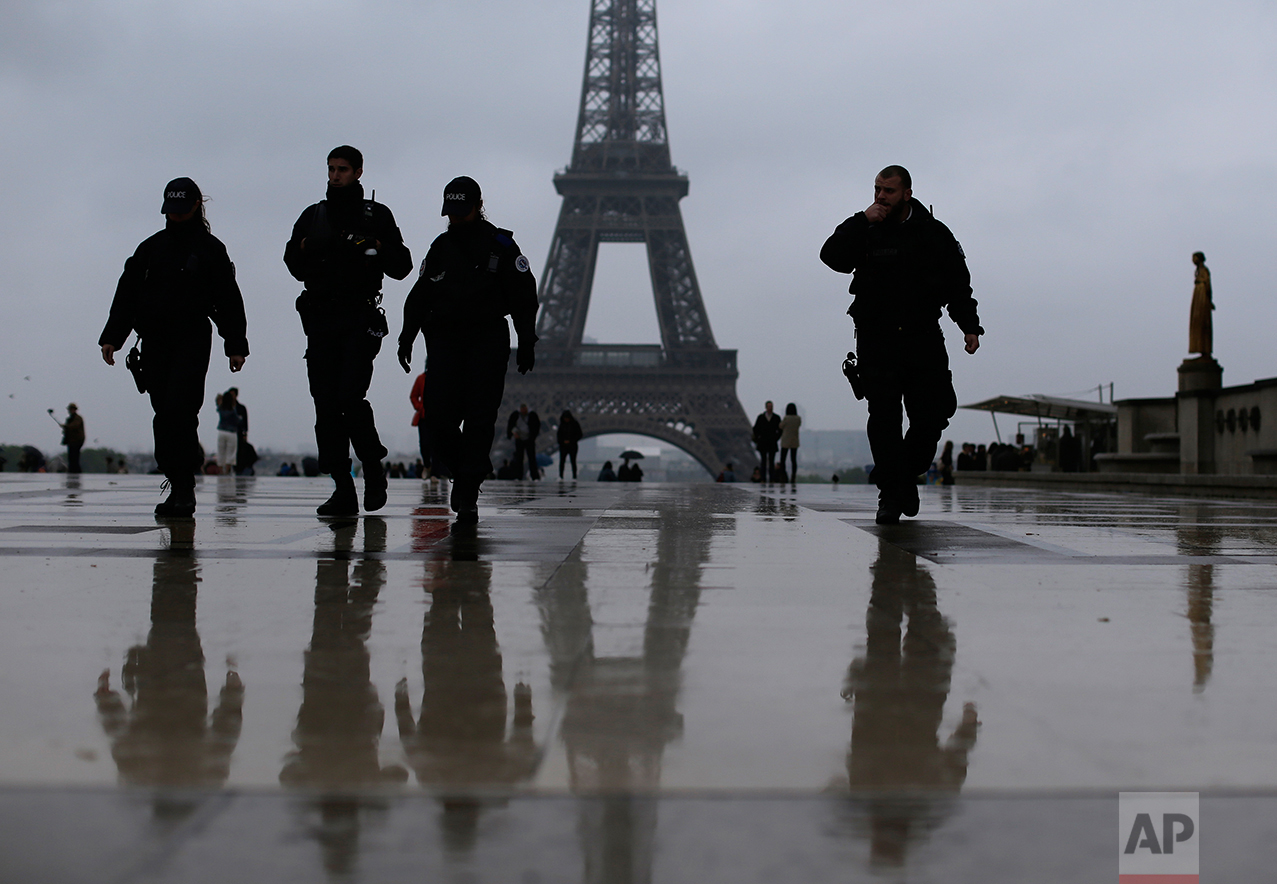  French police officers patrol on the esplanade of the Trocadero in Paris, France Sunday, May 7, 2017. (AP Photo/Emilio Morenatti) 