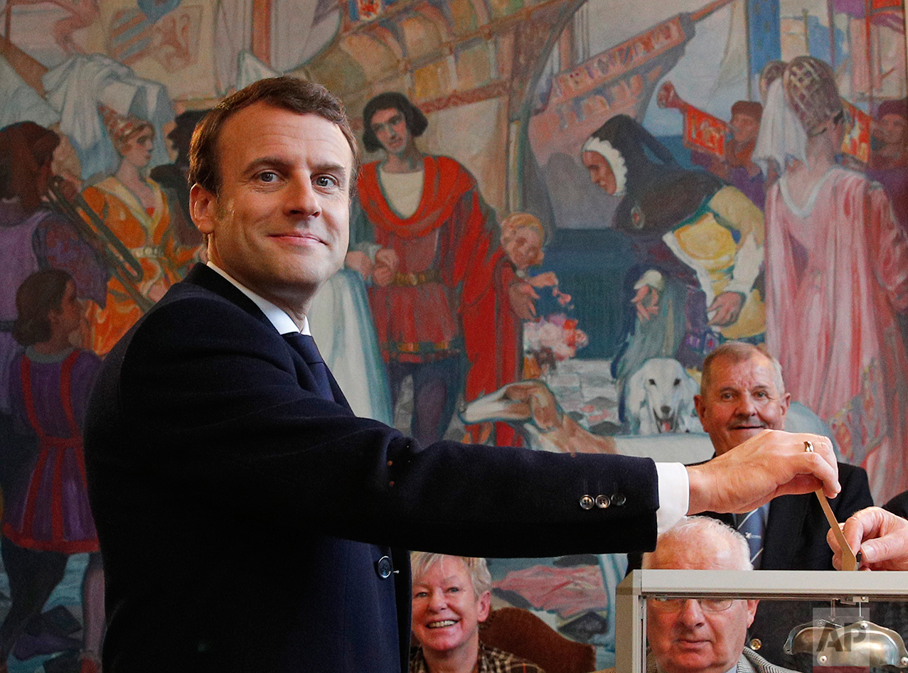  French independent centrist presidential candidate Emmanuel Macron casts his ballot in the presidential runoff election in Le Touquet, France, Sunday, May 7, 2017. (AP Photo/Christophe Ena, POOL) 