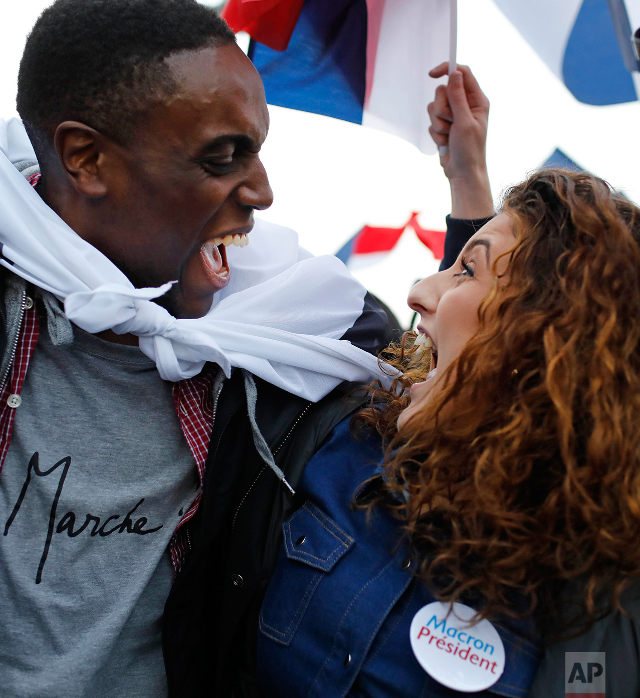  Supporters of French independent centrist presidential candidate, Emmanuel Macron react outside the Louvre museum in Paris, France, Sunday, May 7, 2017. (AP Photo/Laurent Cipriani) 