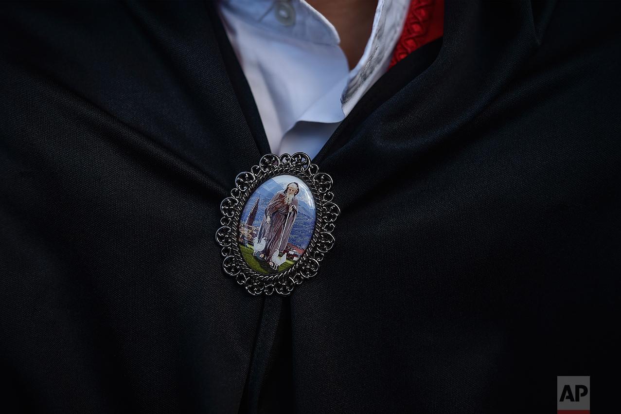  A medallion is seen on the neck of a dancer with the figure of Domingo de La Calzada Saint (1019-1109), who helped poor people and pilgrims, in Santo Domingo de La Calzada, northern Spain, Wednesday, May 10, 2017. (AP Photo/Alvaro Barrientos) 