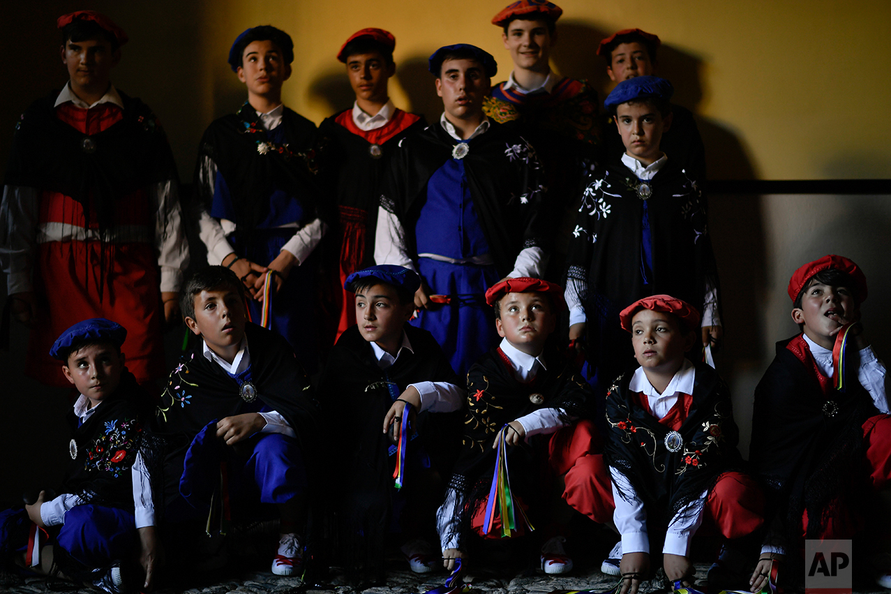  Dancers who will accompany the "Prioress Procession" pose inside of the house Domingo de La Calzada Saint (1019-1109), a saint who helped poor people and pilgrimage, in Santo Domingo de La Calzada, northern Spain, Wednesday, May 10, 2017. Every year