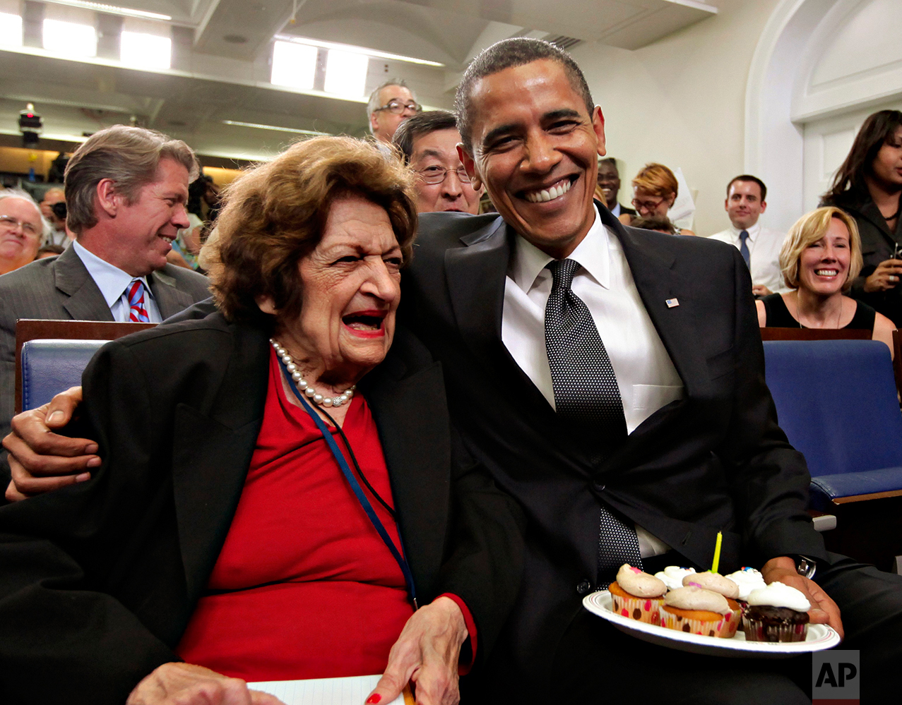 In this Aug. 4, 2009 photo, President Barack Obama, marking his 48th birthday, takes a break from his official duties to bring birthday greetings to veteran White House reporter Helen Thomas, left, who shares the same birthday and turns 89, in the W