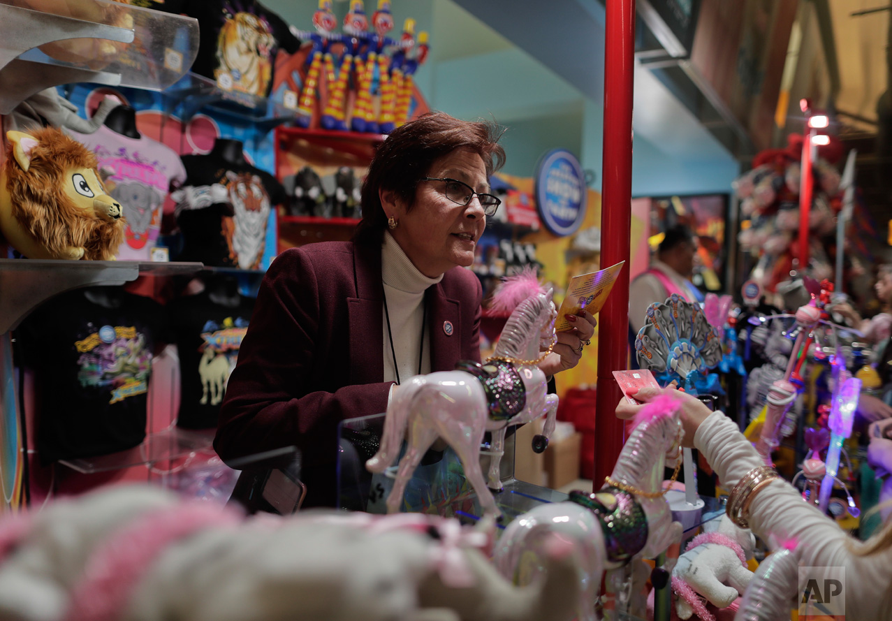  Concessions manager Jeannie Hamilton helps a customer at one of the many memorabilia booths after a show, Saturday, May 6, 2017, in Providence, R.I. While people talk about running away with the circus as freeing, Hamilton said she sometimes felt co