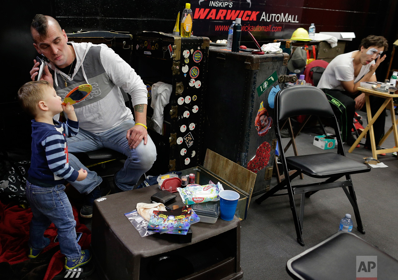  Boss clown Sandor Eke, left, shaves with help from his 2-year-old son, Michael, before putting on his makeup before the opening performance, Friday, May 5, 2017, in Providence, R.I. Eke performed and worked in different roles with Ringling Bros. and