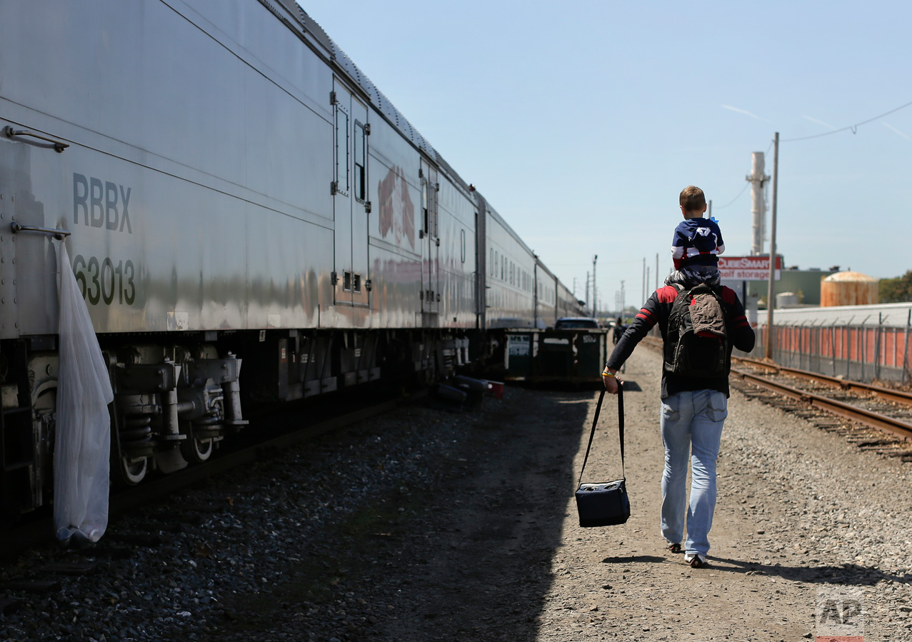  Ringling Bros. boss clown Sandor Eke carries his 2-year-old son, Michael, on his shoulders as he walks to the bus that will take them to the arena for a show, Thursday, May 4, 2017, in Providence, R.I. Someday, he plans to teach his son juggling and