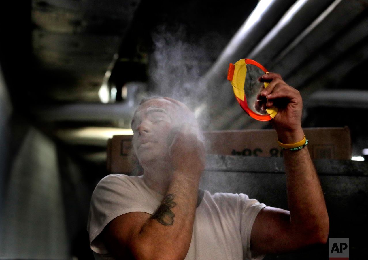  Ringling Bros. boss clown Sandor Eke dusts his face with powder before performing in a show, Friday, May 5, 2017, in Providence, R.I. One of Eke’s earliest memories is of an elephant comforting him, stretching its trunk through his trailer window, w