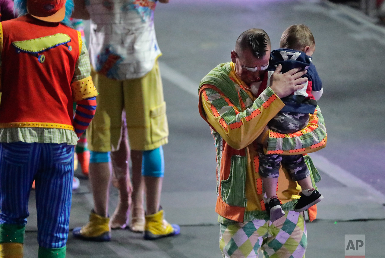  Ringling Bros. boss clown Sandor Eke hugs his 2-year-old son Michael after the red unit's final show, Sunday, May 7, 2017, in Providence, R.I. "The Greatest Show on Earth" is about to put on its last show on earth. (AP Photo/Julie Jacobson) 