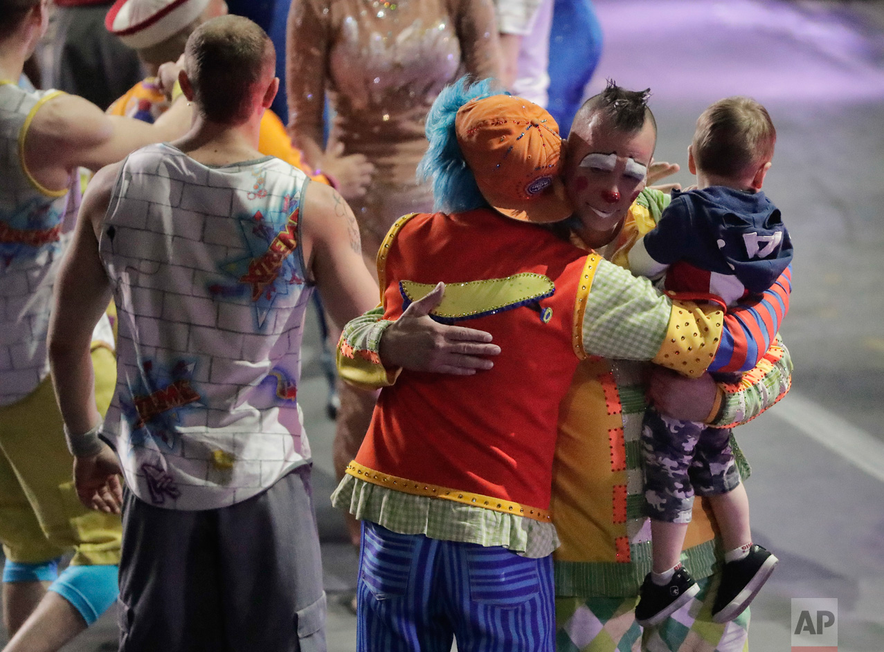  Boss clown Sandor Eke hugs fellow clowns as he holds his 2-year-old son, Michael after the red unit's final performance, Sunday, May 7, 2017, in Providence, R.I. "The Greatest Show on Earth" is about to put on its last show on earth. For the perform