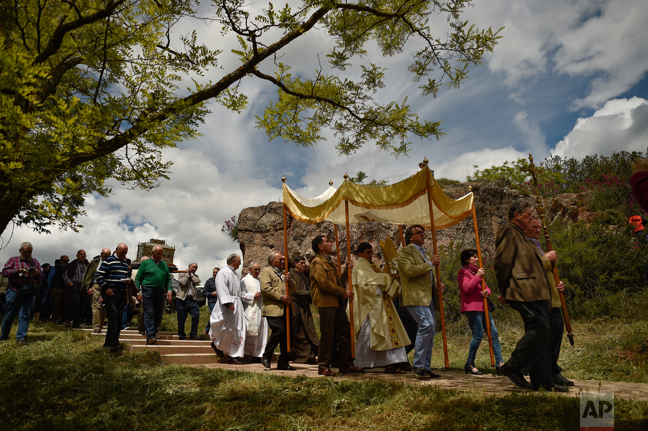  Devotes take part in the pilgrimage with the ancient relic of Saint Gregory in Sorlada, northern Spain, Sunday, May 14, 2017. Every year, devotes of the saint celebrate the blessing of the fields during the pilgrimage carrying the silver head of Sai