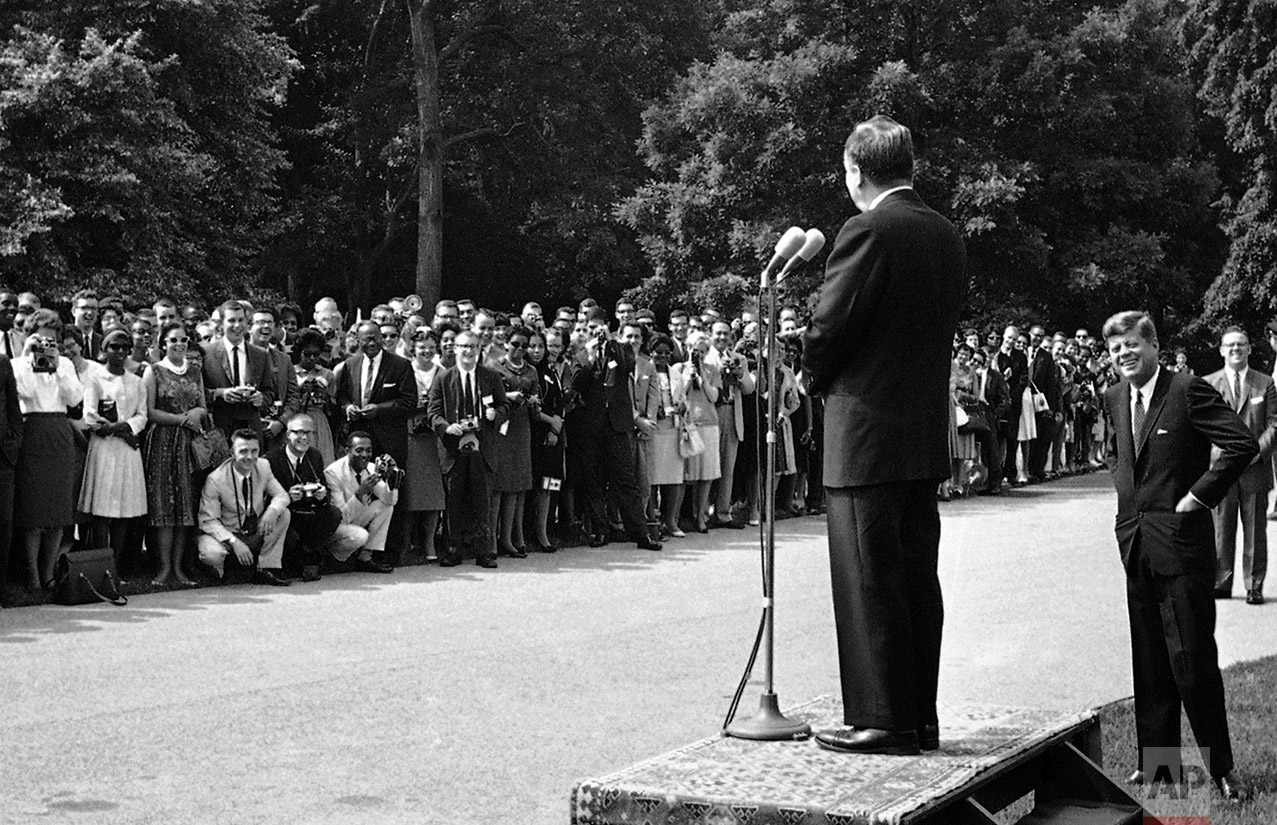  Sen. Hubert Humphrey (D-Minn.), addresses approximately 300 students at the White House in Washington on June 22, 1962, as President John F. Kennedy listens. The students who are going to Africa under the sponsorship of Operation Crossroads Africa, 